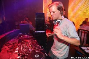 DJ Avicii behind the decks at a club