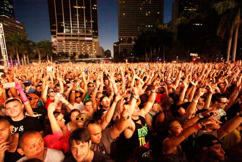 Reach for the Sky: Ultra fans in downtown Miami. By Justin Jarchow-Misch
